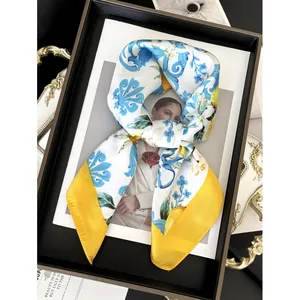 Elegant 70cm silk scarf featuring Mediterranean blue floral patterns and lemon prints