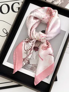 Floral satin silk scarf featuring pink floral patterns on a fashion magazine background