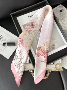Detail of pink floral satin skinny scarf used as a stylish accessory on a fashion magazine