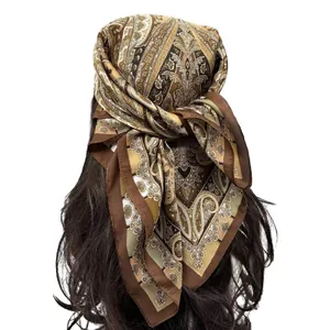 Close-up of bohemian paisley silk scarf showing the elegant brown pattern and texture