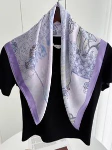 Close-up of elegant lavender floral print silk scarf with purple border and chain motifs