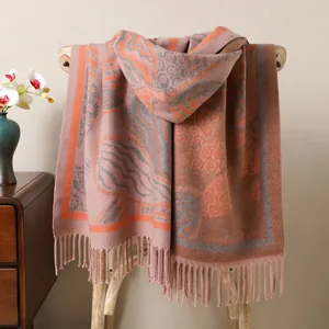 Detailed view of thick double-sided shawl with elegant leaf texture and tassel edges