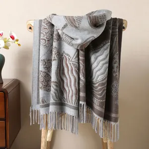 Detailed view of the ethnic pattern texture and long tassels on this thick autumn shawl