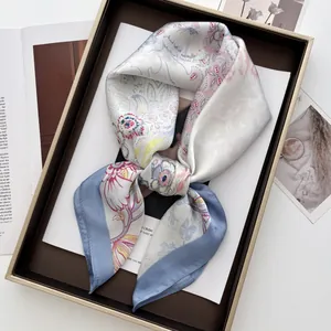 Elegant floral silk scarf in beige and blue, displayed as a gift set for women