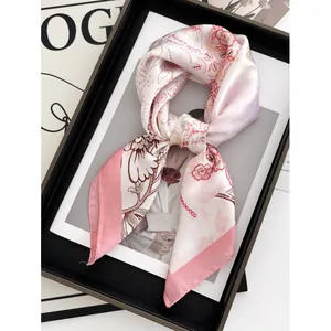 Floral print silk scarf for women in pink and cream on a fashion magazine