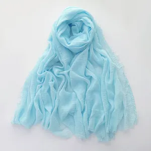 Light blue cotton linen scarf with natural crinkle texture and fringed edges for women