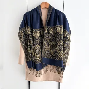 Ethnic style winter shawl in navy blue and gold with floral patterns and tassels