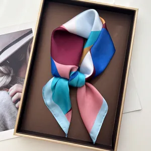 Elegant geometric pattern silk scarf with satin finish in a stylish tray display