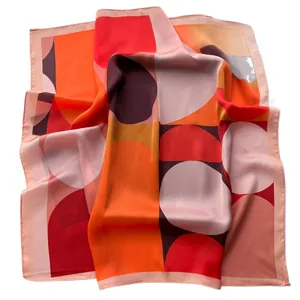 Polished geometric square silk scarf with vibrant orange and purple polka dot patterns