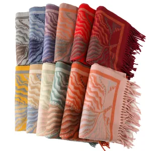 Elegant thick knit shawl for women with wavy patterns and tassels in multiple colors
