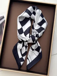 Detailed view of black and white checkerboard silk scarf with elegant knot styling