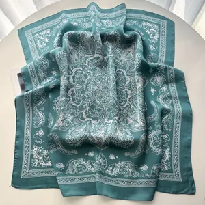 Close-up of vintage floral printed square silk scarf with elegant baroque pattern detail