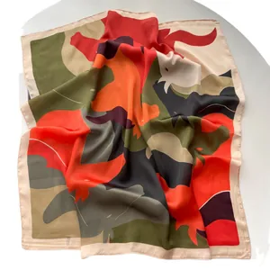 Satin silk square scarf with colorful abstract patterns on white background