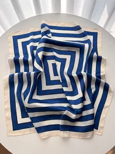 Macro shot of smooth silk-like fabric with blue and white striped geometric pattern