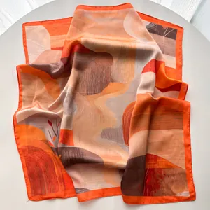 Close-up of elegant abstract mountain river print square scarf with silky satin texture