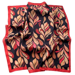 Satin square scarf with red leaf pattern and black border on a white background