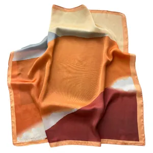 Classic color-block geometric print silk square scarf in orange and burgundy silk fabric