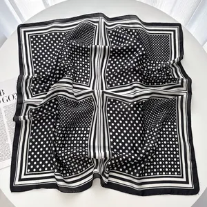 Polished faux silk square scarf featuring black and white polka dots and stripe patterns