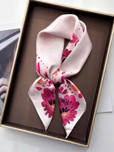 Macro detail of elegant pink floral silk scarf with glossy texture and floral pattern