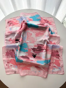 Macro detail of French stripe floral silk scarf showing premium satin texture and hem edge