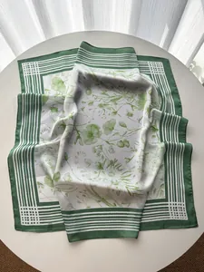 Detail of French striped silk square scarf showing luxury floral print and soft texture