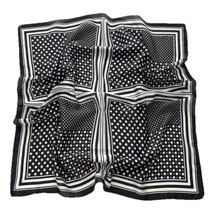 Chic black and white square silk scarf featuring classic polka dots and striped border