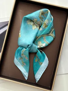Detailed view of Van Gogh's almond blossom print on a smooth faux silk square scarf