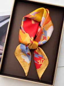Macro shot of colorful abstract silk scarf with vibrant patterns in a luxury gift box