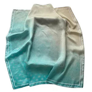 Elegant polka dot square silk scarf featuring a mint green gradient and satin finish