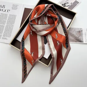 Detailed view of horse print silk scarf with geometric stripes and plaid border