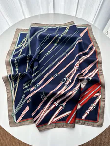 Detail of elegant chain and belt print on premium faux silk square neck scarf shawl