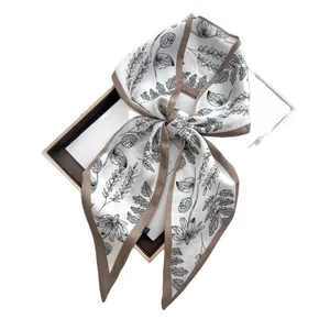 Elegant white silk twilly scarf with black floral print and brown border in gift box