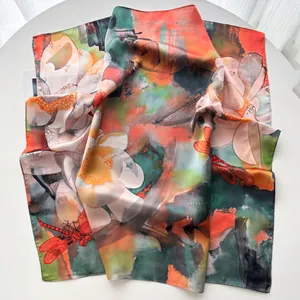 Detailed macro view of floral silk scarf featuring elegant lotus and dragonfly oil painting art