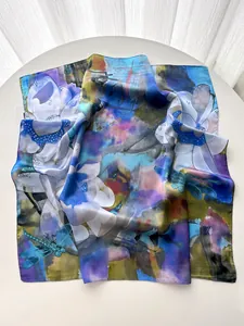 Detailed macro view of high-quality floral silk scarf with artistic dragonfly pattern