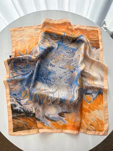 Detail of silk-like scarf with artistic oil painting print in blue and orange colors