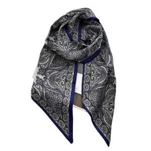 Navy blue paisley print satin scarf featuring a chic contrast border in a flat lay view