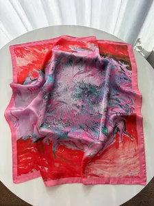 Detailed texture of silk scarf with abstract oil painting print and pink borders
