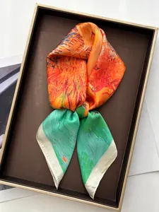 Detail of silk scarf with abstract oil painting print in a premium gift box
