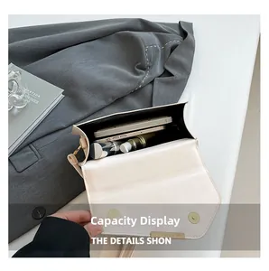 Internal capacity of minimalist linen crossbody bag showing space for phone and makeup