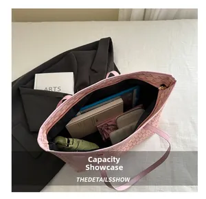 Macro view of the pink tote bag showing spacious interior capacity for daily essentials