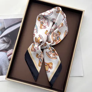 Silk-textured square scarf with playful rocking horse print in premium gift box