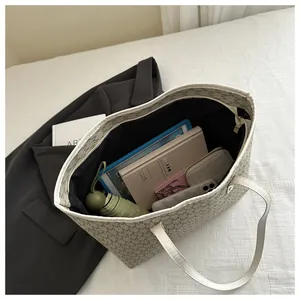 Interior view of spacious vintage print tote bag filled with laptop and daily essentials