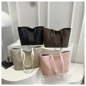 Collection of large vintage monogram tote bags in black, brown, beige, and pink colors