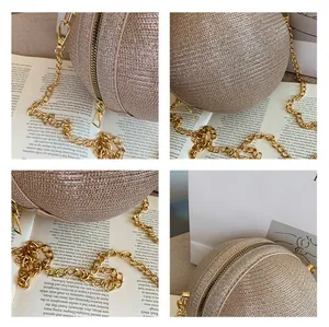 Close-up of golden spherical evening bag showing zipper detail and sequin texture