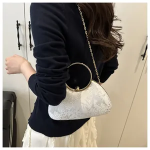 Elegant floral embroidery evening bag with gold ring handle and metal chain strap