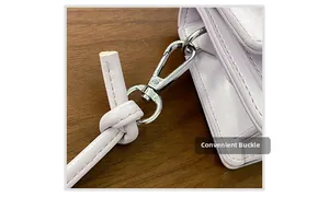 Close-up of the light purple leather bag featuring a silver metal clasp and strap detail