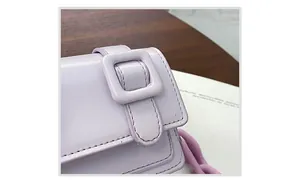 Close-up of lavender purple mini bag with matching resin buckle and chunky chain detail