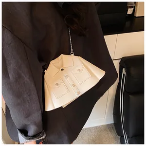 Miniature beige jacket-shaped crossbody bag with metal chain and button details