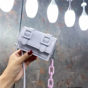 Mini lavender satchel bag with chunky pink chain strap and stylish double square buckles
