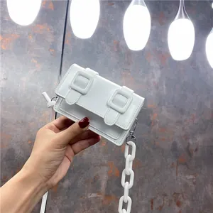 Mini white Cambridge style crossbody bag with chunky plastic chain and flap closure